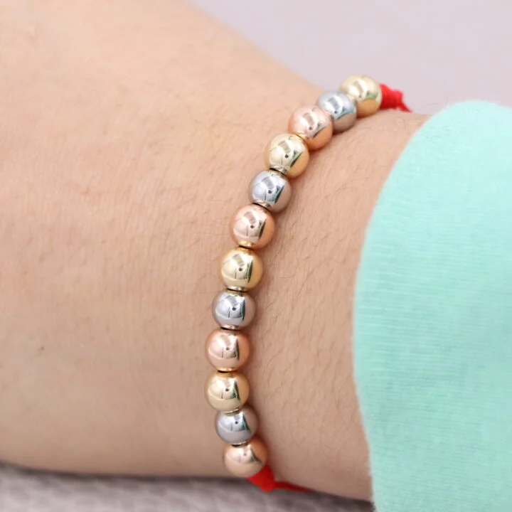 Brazalete rojo tres oros balín oro laminado 18k