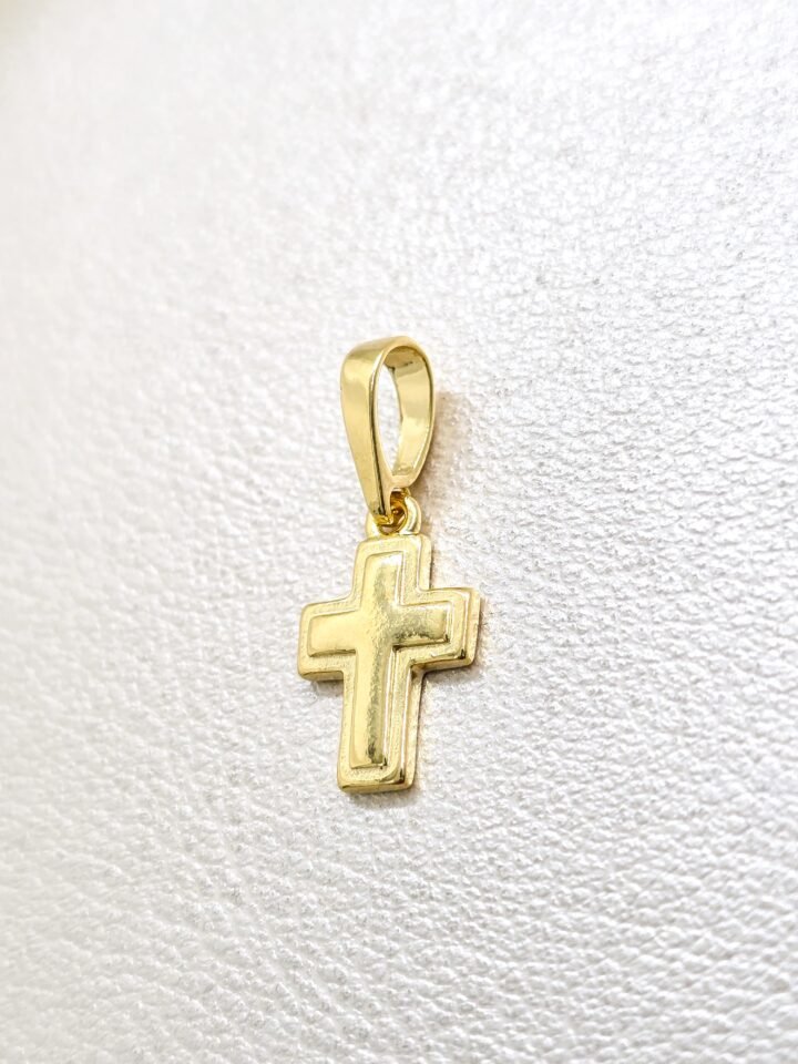 Colgante cruz superpuesta en oro laminado 18k