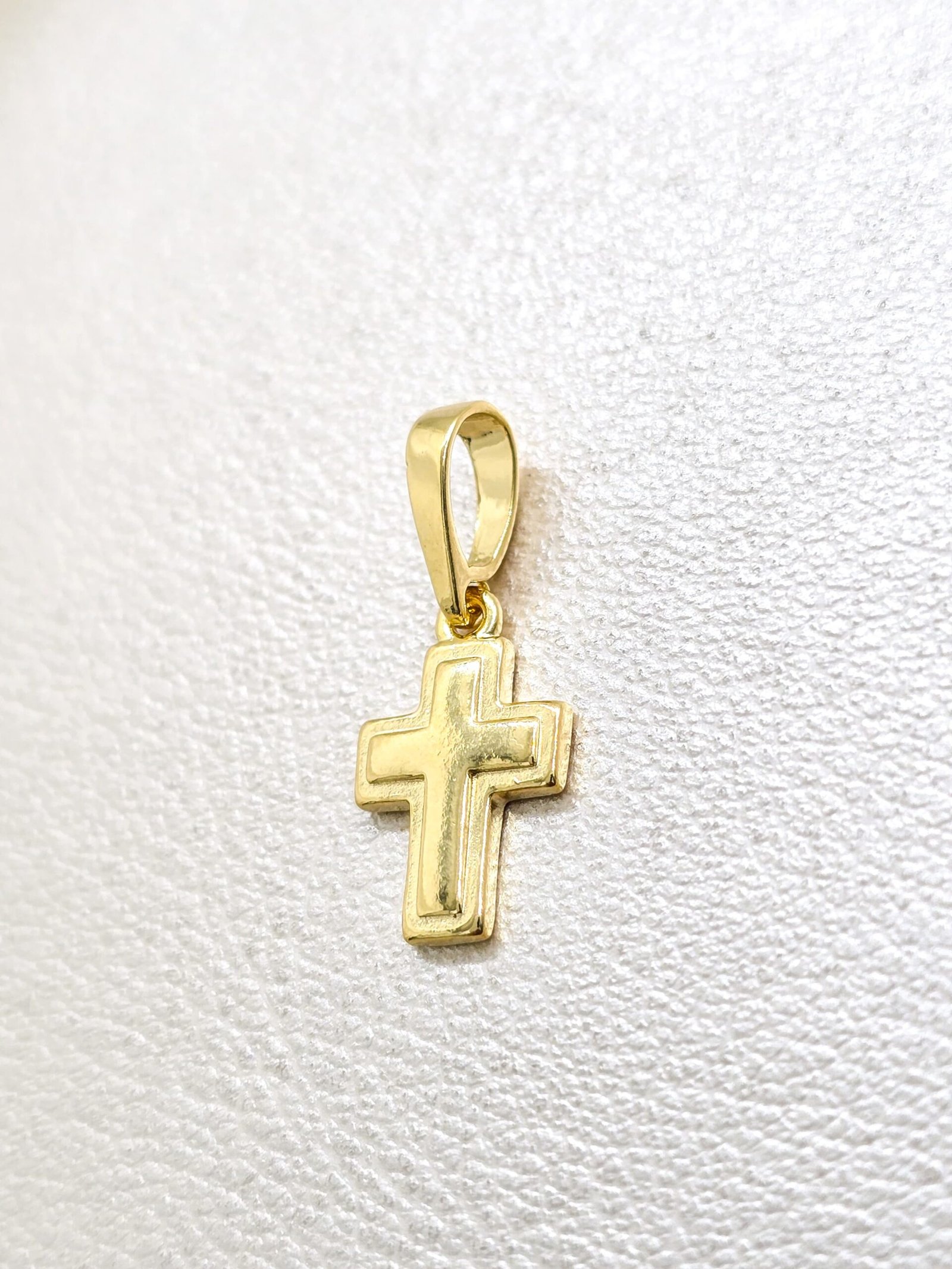 Colgante cruz superpuesta en oro laminado 18k