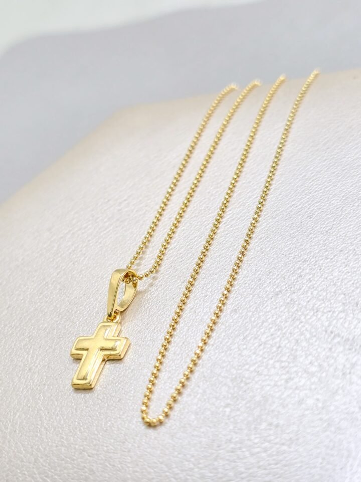 Colgante cruz superpuesta en oro laminado 18k