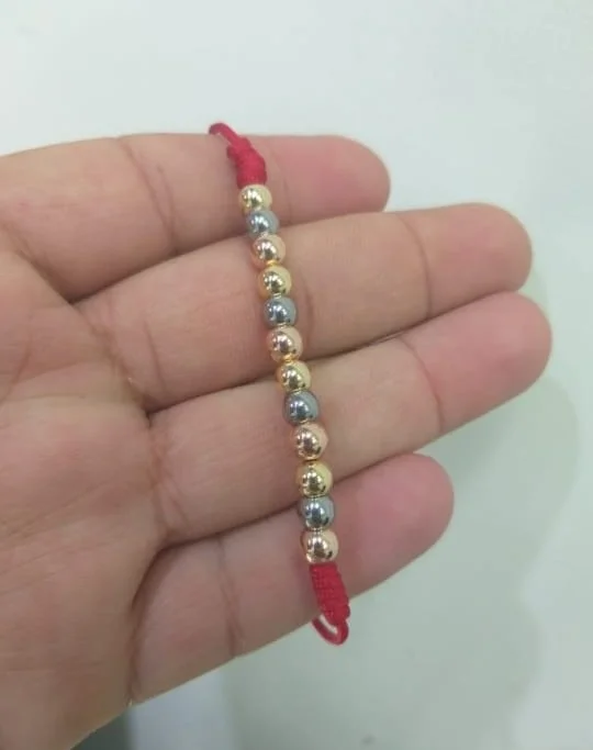 Brazalete rojo tres oros balín oro laminado 18k