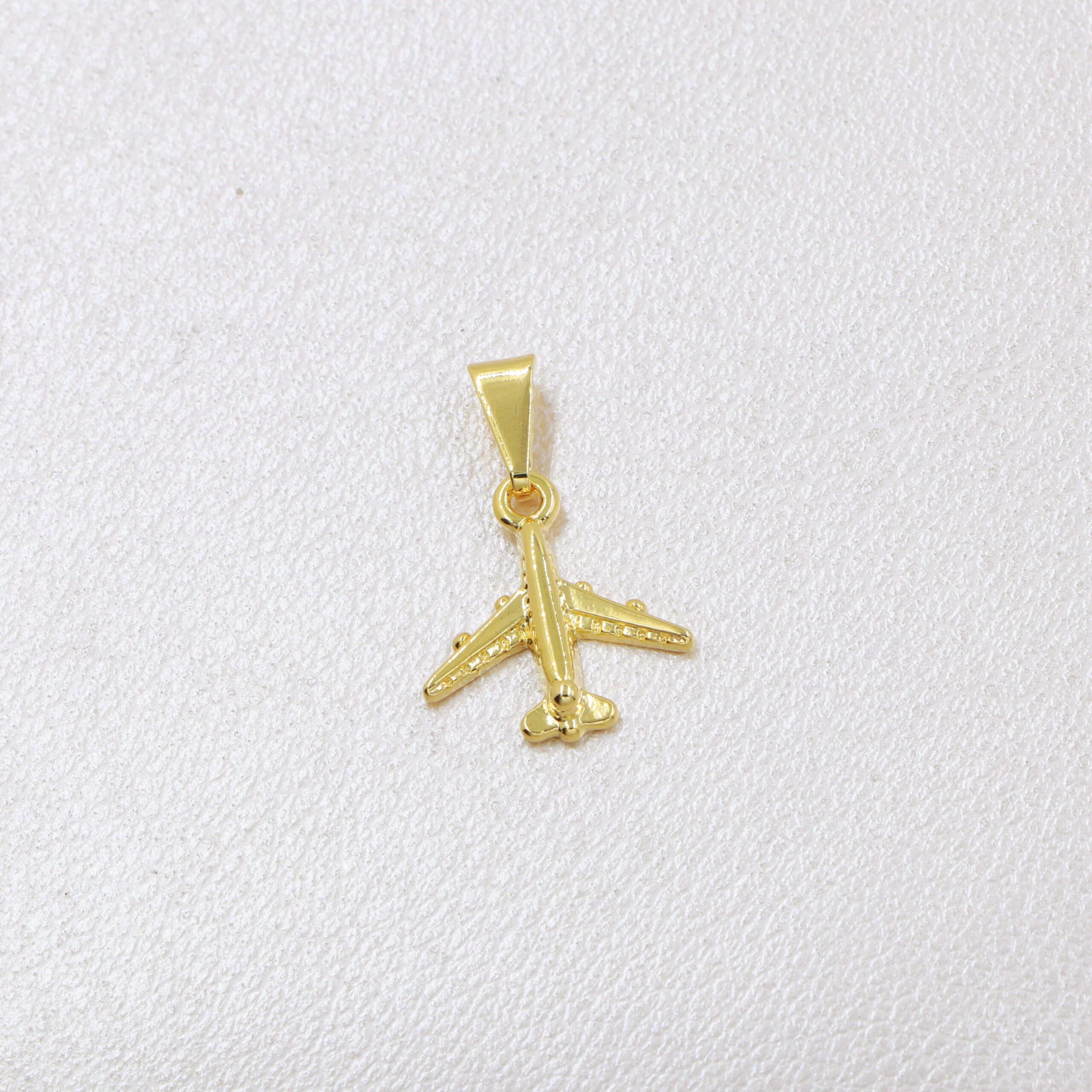 Colgante avión oro laminado 18k