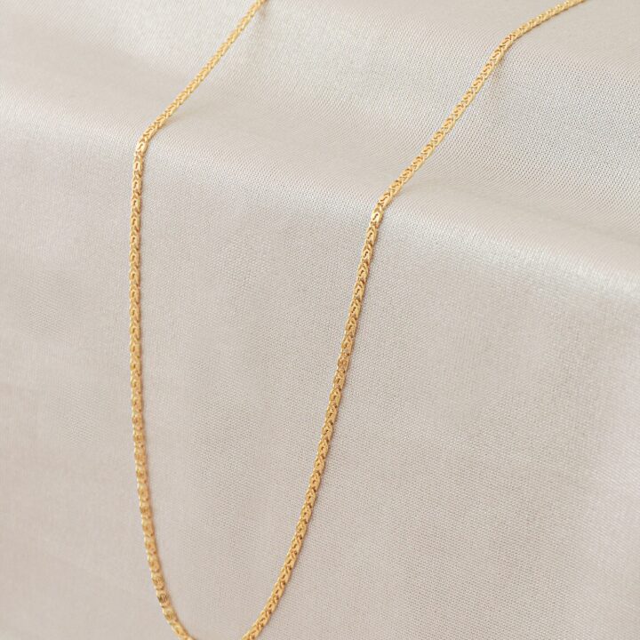Cadena tejido caracol oro laminado 18k