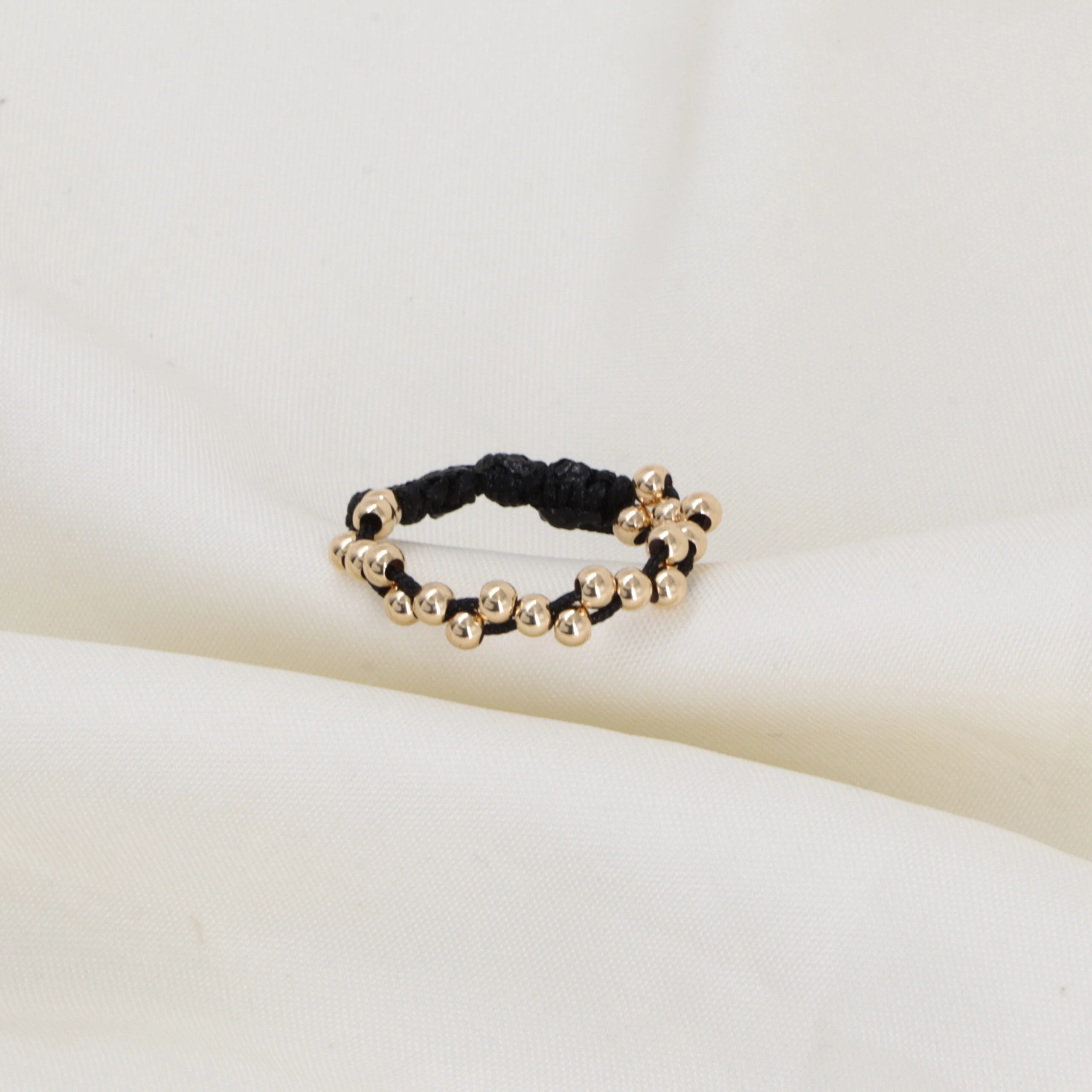 Anillo tejido plano zig zag oro laminado 18k