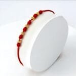 Brazalete clásico con nudos oro laminado 18k